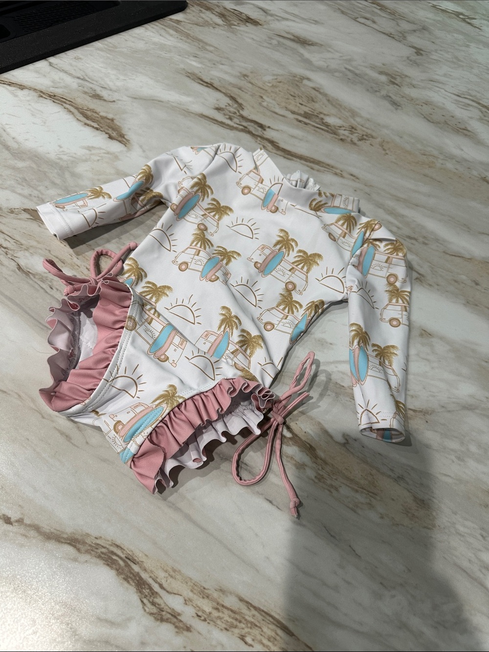 Cutest little swimsuit, need to measure it for size 0/3

Caden lane